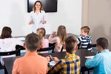 children with teacher in classroom