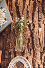 Wedding decor with flowers and candles in the forest