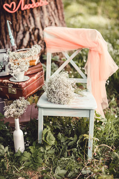 Wedding decor with flowers and candles in the forest
