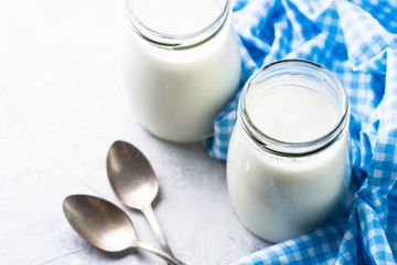 Obraz na płótnie Canvas Fresh homemade greek yogurt in glass jars.