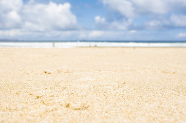 Sandy beach and sky. Summer background. Blurred background