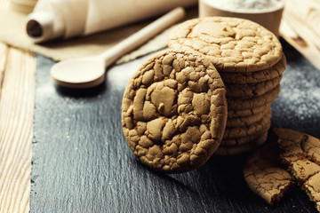 Biscuit sweet cookie background. Domestic stacked butter biscuit pattern concept,close up macro.Homemade cookies on wooden table.Cereal biscuits with the sesame,peanuts,sunflower and amaranth.