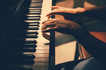 pianist his try to playing piano closeup on his hand and focus one point shallow with depth of field  