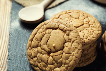 Biscuit sweet cookie background. Domestic stacked butter biscuit pattern concept,close up macro.Homemade cookies on wooden table.Cereal biscuits with the sesame,peanuts,sunflower and amaranth.