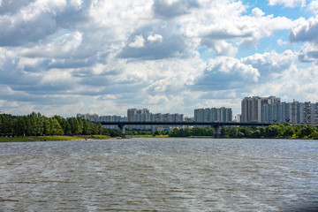 A large multi-storey building on the outskirts of the city. View from the Moscow River
