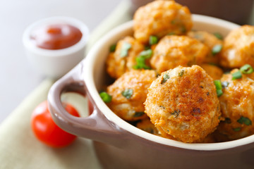 Ceramic dish with delicious turkey meatballs on table, closeup