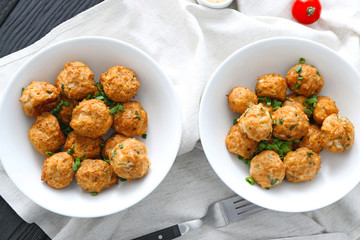 Bowls with delicious turkey meatballs on table