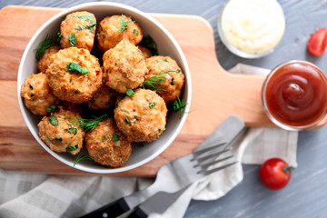 Bowl with delicious turkey meatballs on table