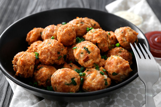 Plate with delicious turkey meatballs on table, closeup