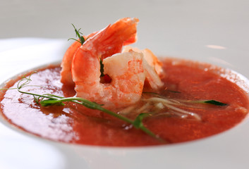 Delicious soup with shrimps in plate, close up