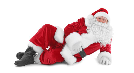 Happy authentic Santa Claus lying against white background