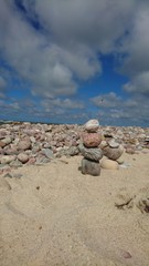 Fototapeta na wymiar Little tower from stones in the beach of Lithuania 