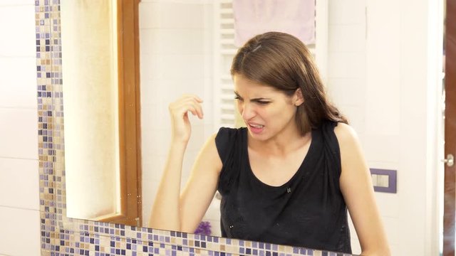 Woman desperate about stinky armpit funny medium shot 4k slow motion