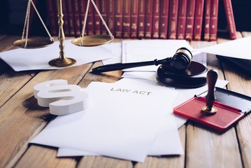 Law act on old wooden desk in library