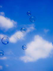 Bubbles against the blue sky in the clouds