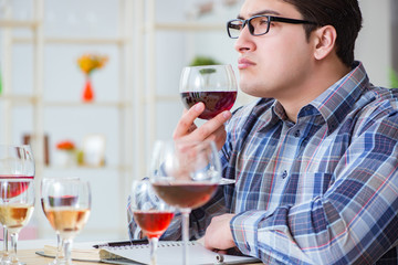 Professional sommelier tasting red wine 