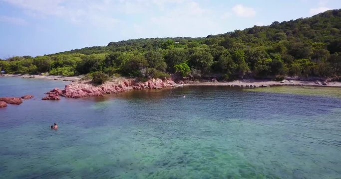 Corsica island people swimming in summer blue water