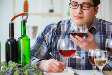 Professional sommelier tasting red wine 