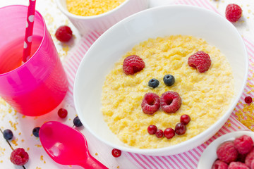 Milk corn porridge for kids healthy breakfast shaped cute pig, creative idea for baby meal