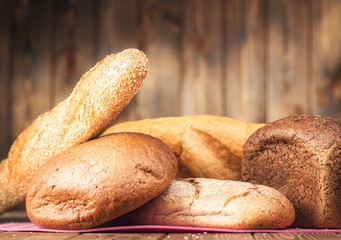 Baked bread on wooden table
