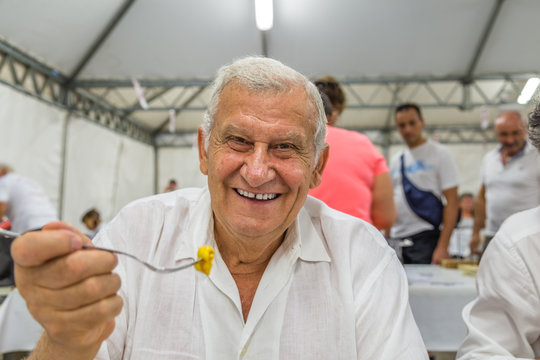 Man Eating Pasta