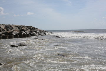 Fototapeta na wymiar Rocky Beach Landscape at Fort Fisher Beach in North Carolina