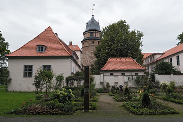 Fototapeta na wymiar The Diepholzer castle with tower and roses garden