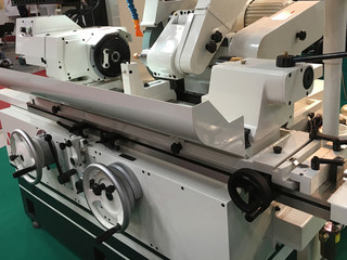 Operator make automotive parts by cnc lathe. Machining lathe.