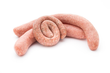 Raw sausages with herbs and spices.