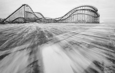 Vintage wooden Rollercoaster on the beach.