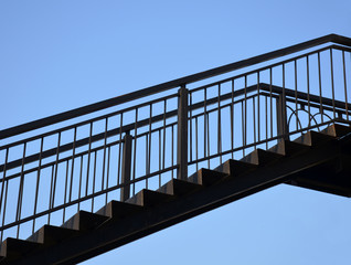 Upstairs on clear blue sky background. Conceptual image about ambitious desire to move up.