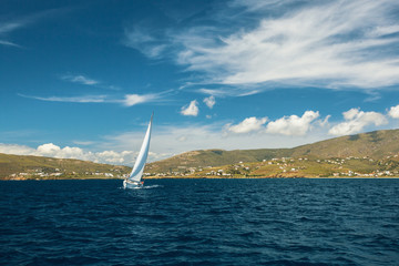Fototapeta na wymiar Sailing yacht at the marina of Andros island, Aegean sea, Greece.
