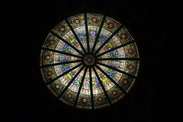 Image of a multicolored stained glass window with regular block pattern