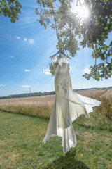 white wedding dress in nature