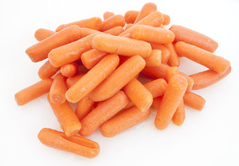 Mound of baby carrots on a white background.