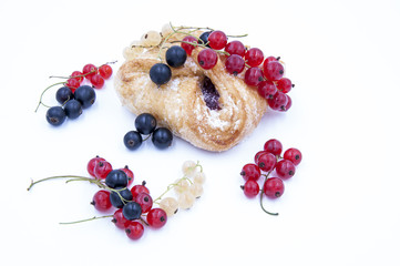 Buns on white background, currant, cherry