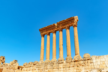 Obraz premium Six columns of Roman Heliopolis at Baalbek in Lebanon. It is located about 85 km northeast of Beirut. It has led to its designation as a UNESCO World Heritage Site in 1984. 