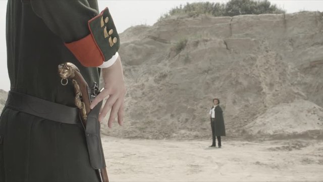 Duel between men's affair of honor. Two people with guns, duel. Cowboys. Wild West Duel close up