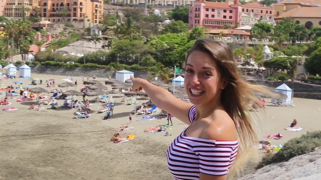 Tenerife. Spain. Beautiful blond girl welcomes you to the beach Playa Del Duque beach, Las Americas. Canary Islands. Girl Travels. .