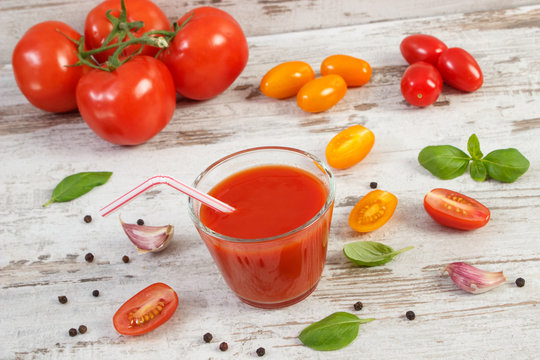 Fresh tomato juice and vegetables with spices, healthy nutrition concept