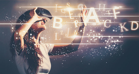 Alphabets with young woman using a virtual reality headset