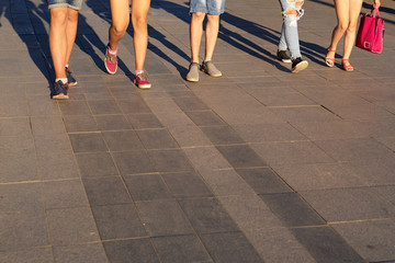 Cropped image of people crossing the street