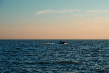 Fototapeta na wymiar sunset on the sea and cutter