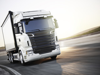 Generic white industrial transport truck traveling down the road with motion blur. Room for copy space. 3d rendering