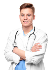 Fototapeta premium Young smiling doctor on white background