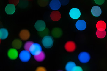 Abstract background of out of focus lights at night. Light hexagon.