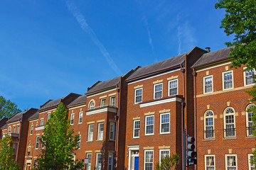 Fototapeta na wymiar Historic red brick townhouses in Georgetown neighborhood of Washington DC, USA. Historic urban architecture of US capital in spring.