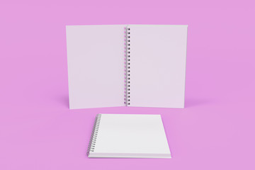 Two notebooks with spiral bound on violet background