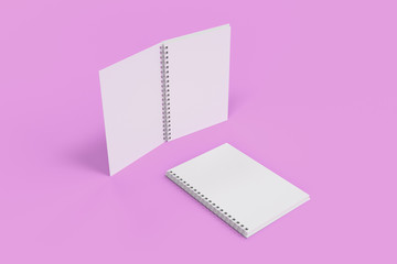 Two notebooks with spiral bound on violet background