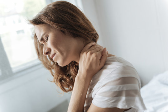 Gloomy Cheerless Woman Touching Her Neck